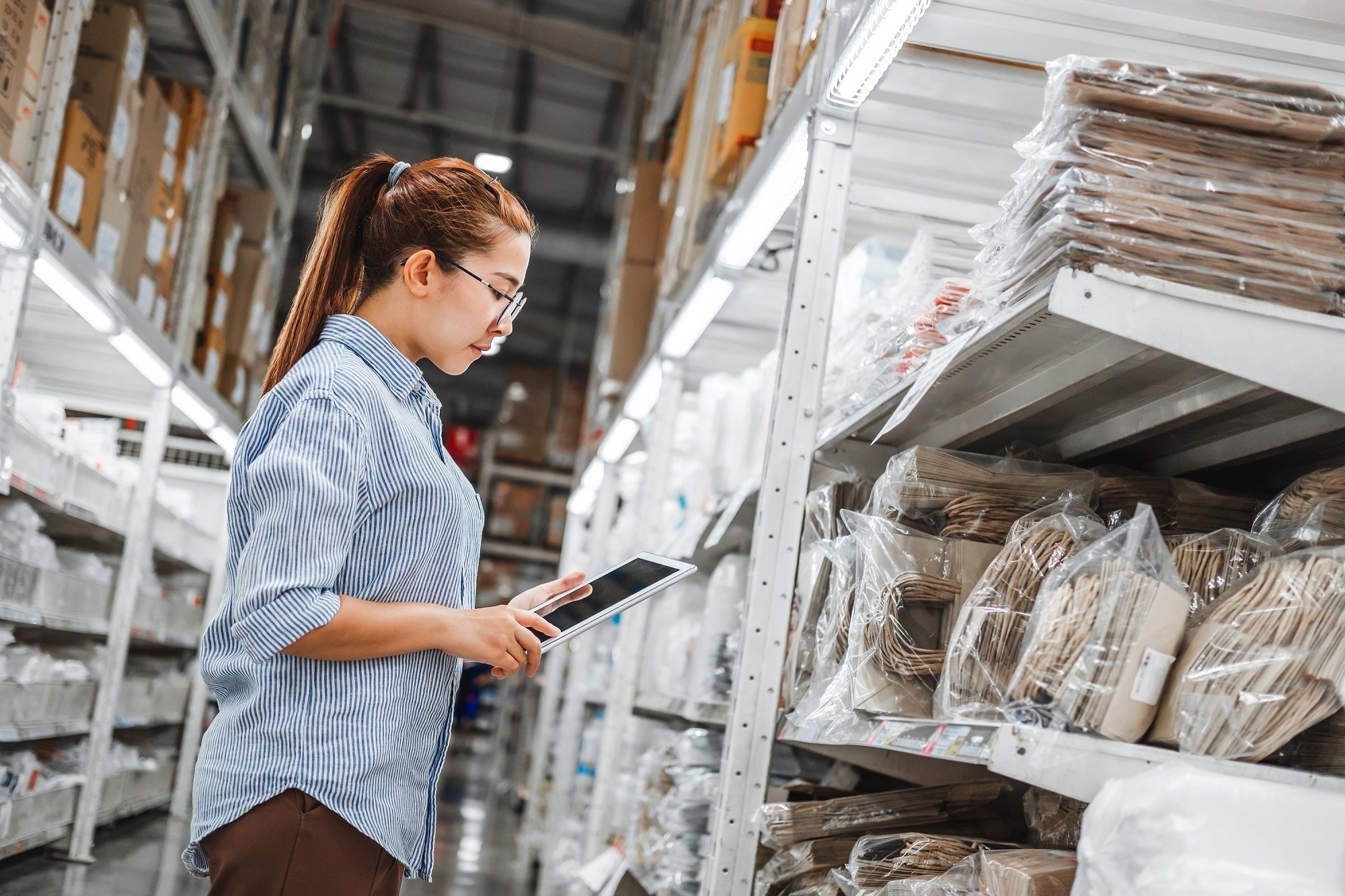 Girl taking inventory with iPad