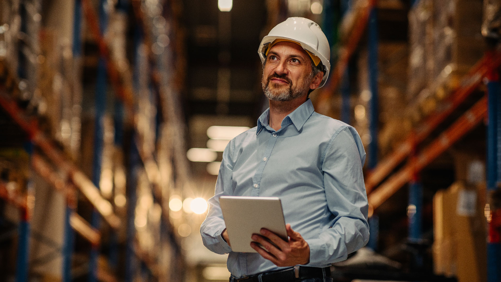 Man with tablet in the warehouse